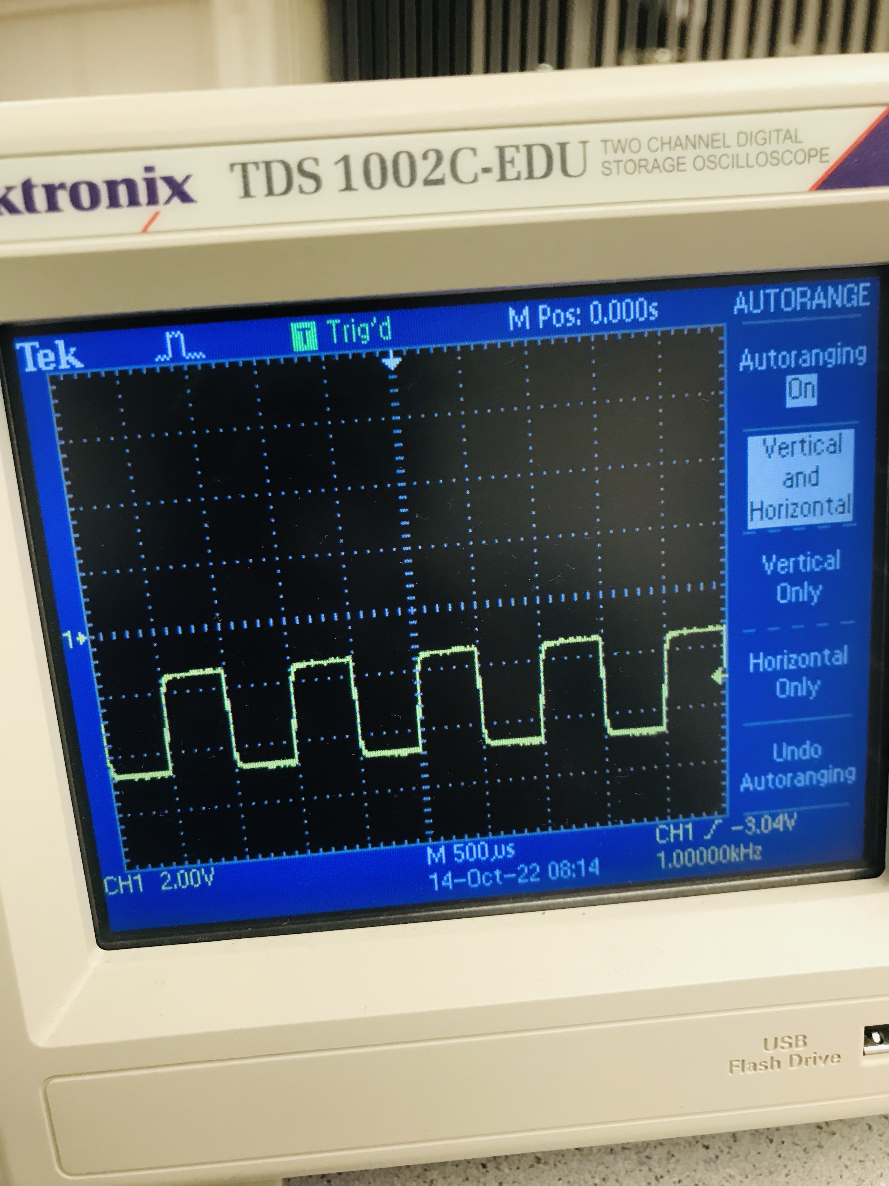 Oscilloscope measuring a 1kHz signal
